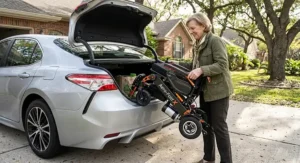 Compact lightweight folding power wheelchair designed for fast transport and easy car trunk storage.